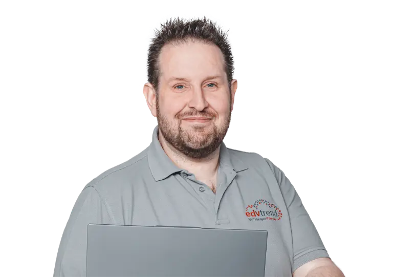 Ansprechpartner von edv-trend im Firmenpolo mit Laptop